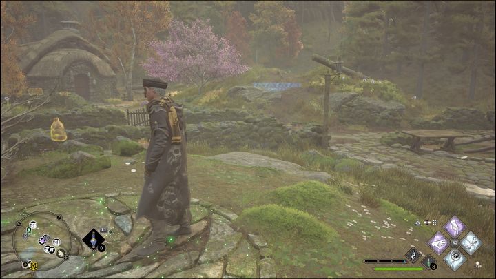 W tej próbie musicie doprowadzić dużą kulę do wgłębienia w ziemi, które na zdjęciu jest podświetlone na niebiesko - Hogwarts Legacy: Dolina Hogwartu - wszystkie Łamigłówki Merlina - Hogwarts Legacy - poradnik do gry