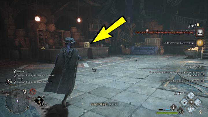 Tomik wierszy znajdziecie w niebieskim pudełku na ladzie, w tym samym pomieszczeniu w którym pokonaliście dużą grupę przeciwników - Hogwarts Legacy: Podstawy szantażu (A Basis for Blackmail) - Hogwarts Legacy - poradnik do gry