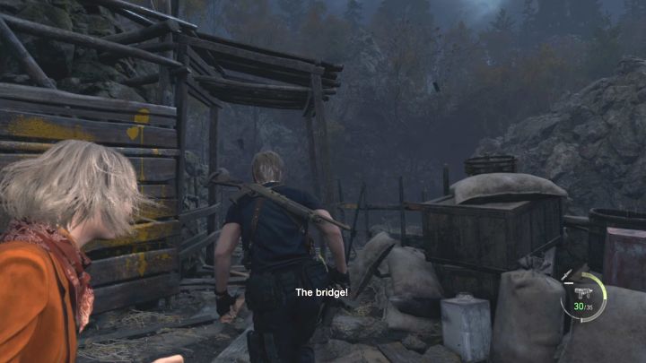 Most linowy, do którego dotrą Leon i Ashley, zostanie zdetonowany - Resident Evil 4 Remake: Jak uciec Mendezowi w rozdziale 6? - Resident Evil 4 Remake - poradnik do gry