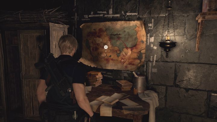 Zawieszona na ścianie mapa jest w tym samym bocznym pomieszczeniu kościoła, co sekret opisany powyżej - Resident Evil 4 Remake: Sekrety Files - Village - Resident Evil 4 Remake - poradnik do gry