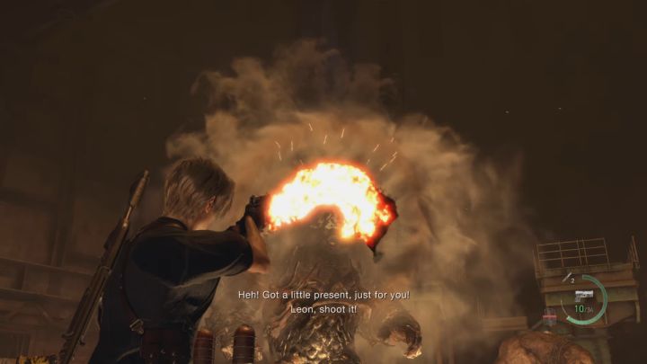 Towarzysz rzuci dynamitem, który przyczepi się do pancerza El Gigante - Resident Evil 4 Remake: Jak pokonać bossów Dos Gigantes? - Resident Evil 4 Remake - poradnik do gry