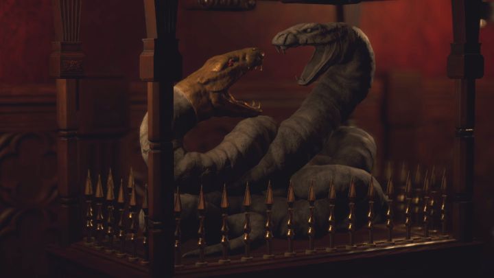 Jeśli wybraliście prawidłowe miejsca, to otworzy się klatka z wężami - Resident Evil 4 Remake: Zagadka z krzesłami z jadalni (Dining Hall) - Resident Evil 4 Remake - poradnik do gry