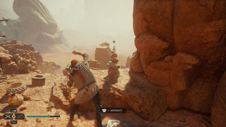 Zwój z Jedhy jest na jednej z górnych półek, niedaleko windy podróżującej do Krypty Uhrmy i punktu widokowego, z którego widać Niszczejący most - Jedi Survivor: Wietrzny płaskowyż z planety Jedha - lista sekretów - Star Wars Jedi Survivor - poradnik do gry