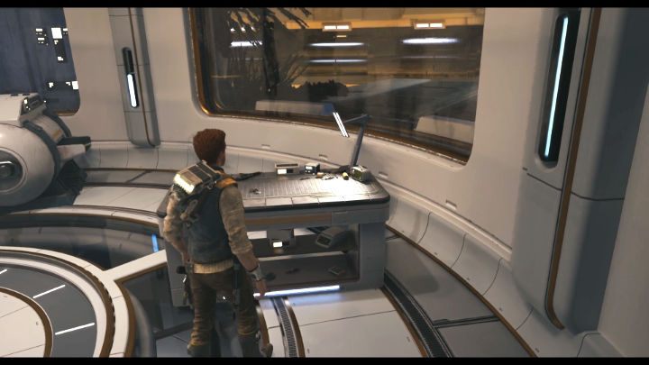 Wejdźcie w interakcję ze stołem warsztatowym w okrągłym pomieszczeniu, aby aktywować przerywnik filmowy, w trakcie którego otrzymacie Ulepszoną linkę do wspinaczki (Upgraded Ascension Cable) - Star Wars Jedi Survivor: Znajdź Rayvisa na zniszczonym księżycu (Locate Rayvis on the Shattered Moon) - Star Wars Jedi Survivor - poradnik do gry