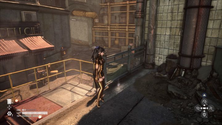 Puszka leży na ziemi niedaleko tablicy ogłoszeń we wschodniej części miasta - Stellar Blade: Wszystkie puszki - Stellar Blade - poradnik do gry