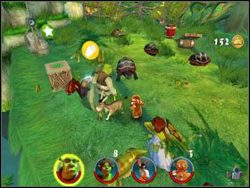 Podnosimy specjalne ciastko, które po chwili wykorzystujemy do wciągnięcia żółwi do pułapek - [Solucja] Etap 1 - Bagno Shreka cz.2 | Shrek 2 Team Action - Shrek 2: Team Action - poradnik do gry
