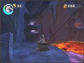 Wskocz na pal i używając ciężkiego stąpnięcia (stomp move - Skok, Skok + Atak), odwiąż linę - SLOTH VILLAGE 05 (cz.2) - Epoka Lodowcowa 2: Odwilż - poradnik do gry