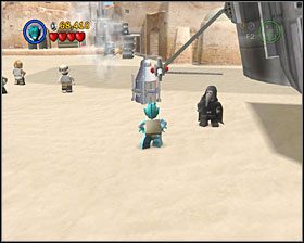 Jako Łowca Nagród zniszcz Detonatorem pokazany obok kawałek żelastwa (ten na środku oczywiście) - Episode IV - Mos Eisley Spaceport | Freeplay Mode - LEGO Star Wars II: The Original Trilogy - poradnik do gry