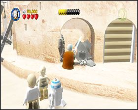 Gdy dojdziesz do sporego placu, będziesz musiał skompletować z porozrzucanych po okolicy klocków kompletnego AT-ST - Episode IV - Mos Eisley Spaceport | Story Mode LEGO Star Wars II - LEGO Star Wars II: The Original Trilogy - poradnik do gry