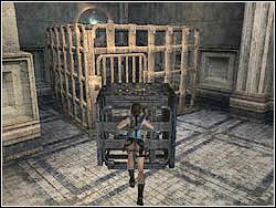 Rzuć teraz linką i zaczep ją o obręcz w małej klateczce - 07. Koloseum (2) | Grecja w Tomb Raider Anniversary - Tomb Raider: Anniversary - poradnik do gry