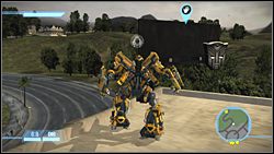 Za billboardem na jednym z budynków - The Suburbs - Ikony | Kampania Autobotów | Transformers The Game - Transformers: The Game - poradnik do gry