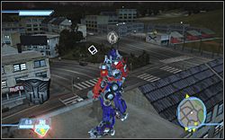 Na jednym z budynków w pobliżu dodatkowego zadania (Race) - More Than Meets the Eye - Ikony | Kampania Autobotów | Transformers The Game - Transformers: The Game - poradnik do gry
