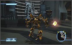 Przy zamrożonym Megatronie (dostęp do tego miejsca uzyskujesz dopiero po wykonaniu trzech zadań w scenerii) - Inside Hoover Dam - Ikony | Kampania Autobotów | Transformers The Game - Transformers: The Game - poradnik do gry