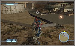 Niedaleko okrągłego budynku z paliwem na The Aircraft Depot - A Gathering Force - Ikony | Kampania Deceptikonów | Transformers The Game - Transformers: The Game - poradnik do gry