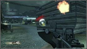 Nieco dalej sytuacja z przed chwili stanie na głowie, czyli to Ty będziesz mieć możliwość pchnięcia przyczepy w kierunku napastników (za pomocą punktu aktywacyjnego widocznego na zdjęciu) - RACHEL - Domestic Surveillance | BlackSite Area 51 - BlackSite: Area 51 - poradnik do gry