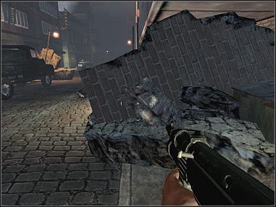 Docelowo będziesz musiał dobiec do ukazanego na screenie przejścia, które znajduje się na lewo od rozstawionej przez wroga blokady - Poziom trzeci (cz.1) | Akt 1 - Nowy Jork | Turning Point: Fall of Liberty - Turning Point: Fall of Liberty - poradnik do gry