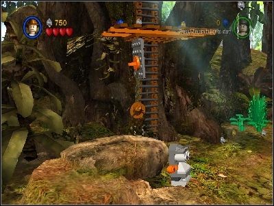Po lewej stronie zobaczysz zakopaną złotą głowę - Chapter 1 - The Lost Temple (cz.1) - Poszukiwacze Zaginionej Arki - LEGO Indiana Jones: The Original Adventures - poradnik do gry