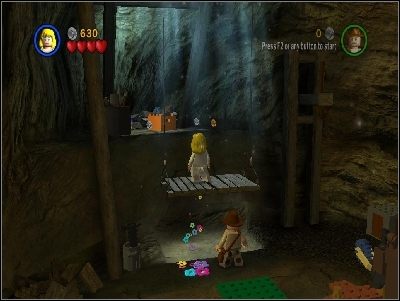 Zmień postać na Indiego i użyj bicza na podświetlonym miejscu - Chapter 4 - Free the Slaves (cz.1) - Świątynia Zagłady - LEGO Indiana Jones: The Original Adventures - poradnik do gry