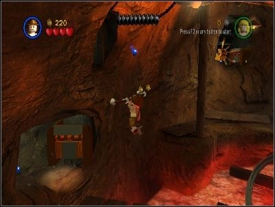 Udaj się w tamtym kierunku, przeskakując na linie i używając poręczy - Chapter 4 - Free the Slaves (cz.1) - Świątynia Zagłady - LEGO Indiana Jones: The Original Adventures - poradnik do gry