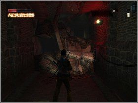 Cofnij się do zakratowanego pomieszczenia tuż koło miejsca, gdzie zeskoczyłeś - Upadek na dno - Część trzecia - The Suffering: Zniewolony - poradnik do gry