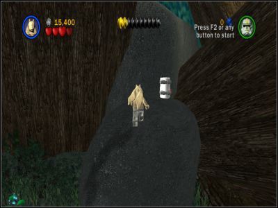 Po znalezieniu się na plaży, skieruj się na duży głaz leżący w prawym, górnym narożniku wyspy - Chapter 4 - Defense of Kashyyyk - Free Play - Episode 3 - LEGO Star Wars: The Complete Saga - poradnik do gry