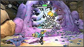 Przechodzimy przez fioletowe przejście i zeskakujemy na okrągłą platformę - Krell Canyon | Opis przejścia | Ratchet & Clank A Crack in Time - Ratchet & Clank: A Crack in Time - poradnik do gry