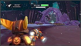 Znajduje się nieopodal jednego z wolnych mieszkańców, którym trzeba pomoc z otwarciem przejścia - Korthos Sector - Tombli Outpost | Sekrety | Ratchet & Clank A Crack in Time - Ratchet & Clank: A Crack in Time - poradnik do gry