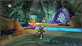 W jaskini przeskakujemy dwa mury napełniając kwiatki wodą i odciągając termity używając soku - Korthos Sector - Lumos, Krall Canyon | Sekrety | Ratchet & Clank A Crack in Time - Ratchet & Clank: A Crack in Time - poradnik do gry