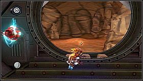Podnosimy baterię kluczem i przeskakujemy na odizolowane drzwi na północ - Korthos Sector - Lumos, Krall Canyon | Sekrety | Ratchet & Clank A Crack in Time - Ratchet & Clank: A Crack in Time - poradnik do gry