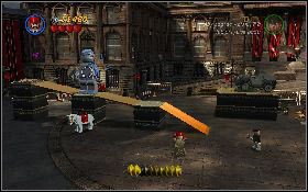 Przy jej pomocy zniszcz posąg na dole lokacji [1] oraz drugi, znajdujący się na rampie [2] - Niebezpieczne parkowanie (bonus) | Ostatnia Krucjata | LEGO Indiana Jones 2 - LEGO Indiana Jones 2: The Adventure Continues - poradnik do gry