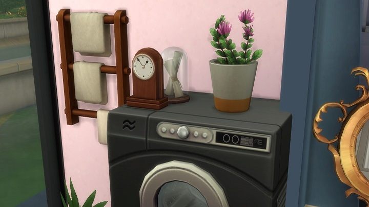 I placed a dryer on top of the washing machine, and then topped it off with a flower pot, a clock, and a glass lampshade – nothing fell, nothing broke. Nothing! That's a simulation of life? If I'd done it irl it would all shatter! - Spending $10 for Laundry in The Sims 4 is My Worst Decision This Year - dokument - 2020-03-09